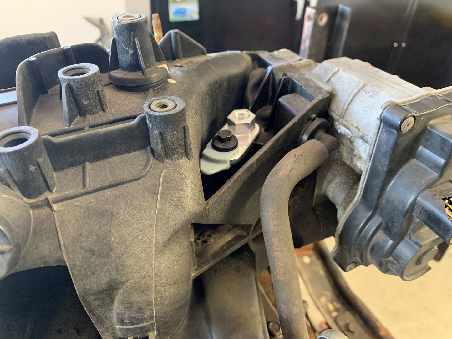 Combination plug and boost port for LS truck engine intakes